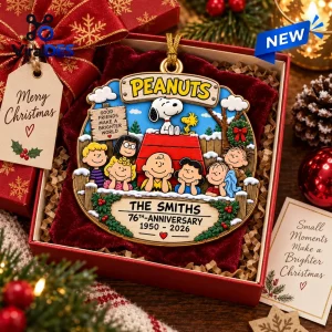 Peanuts 76th Anniversary Christmas ornament featuring Snoopy, Woodstock, and the gang in a festive gift box.