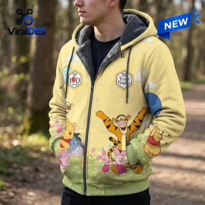 Winnie the Pooh 100th Anniversary Fleece Zip Hoodie with yellow base, grey lining, and character prints of Tigger and Piglet.