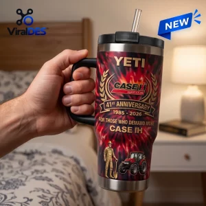 Case IH 41st Anniversary Stanley Tumbler with red flame graphics, farmer icon, and tractor imagery held in a hand.