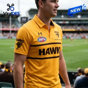 Hawthorn Football Club Gold Polo Shirt with black horizontal stripes, AFL logo, and team insignia on a player at a stadium.