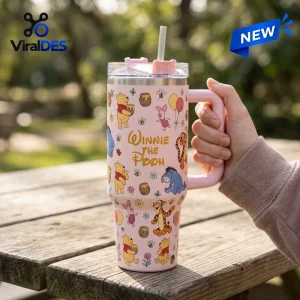Winnie the Pooh Pink 40oz tumbler with a handle, straw, and cartoon patterns of Pooh, Piglet, Tigger, and honey pots.