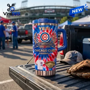 Front view of a Chicago Cubs 156th Anniversary Stanley Tumbler with red, white, and blue tie-dye pattern on a truck bed.
