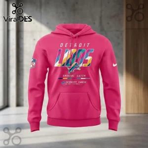 Detroit Lions 2026 Crucial Catch Pink Hoodie with white and multicolor team graphics and an NFL patch on the sleeve.