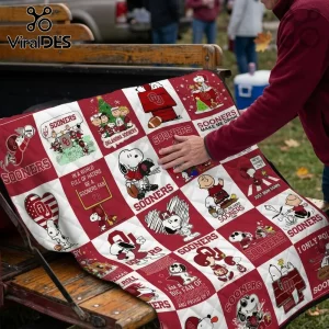 Oklahoma Sooners Snoopy Peanuts Christmas fleece blanket featuring team colors, cartoon character panels, and football motifs.