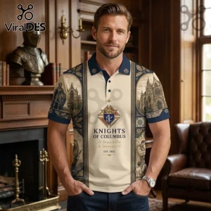 Knights of Columbus Heritage Polo Shirt featuring navy trim, cathedral graphics, and official K of C emblem on cream fabric.