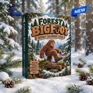 Front view of the Forest Bigfoot Hand-Carved Advent Calendar box sitting in snow with pine trees in the background.