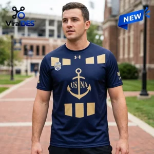 Front view of a man wearing a Navy Midshipmen 100th Anniversary National Champions shirt with anchor graphic.