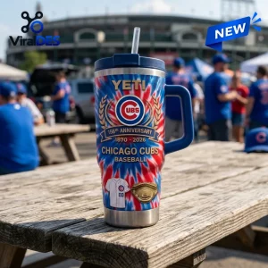 Front view of a Chicago Cubs 156th Anniversary Stanley Tumbler featuring red and blue tie-dye graphics on a wooden table.