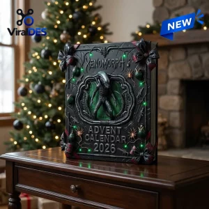 Front view of an Alien Xenomorph 2026 Advent Calendar on a wooden table with a Christmas tree background.