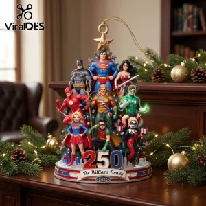 Justice League 2026 Superhero Christmas Tree Ornament featuring Batman, Superman, Wonder Woman, and others on a base.