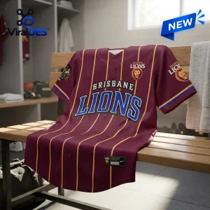 Maroon Brisbane Lions baseball jersey with gold pinstripes displayed on a wooden bench.