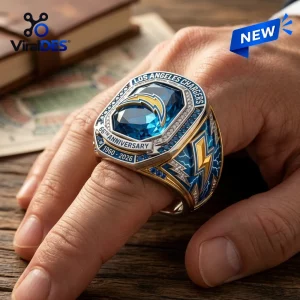 Closeup of a Los Angeles Chargers 66th Anniversary Ring worn on a hand.