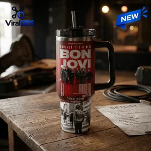 Bon Jovi Forever Legendary Edition Stanley Tumbler with red graphic band, black handle, and band imagery on wooden desk.
