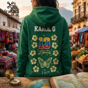Karol G x Philadelphia Eagles Tropitour Green Hoodie featuring the number 13, hibiscus flowers, and a butterfly graphic.