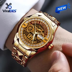 Indian Motorcycle 125th Anniversary Quartz Watch with a gold-tone band, diamond-studded bezel, and vintage bike graphic.