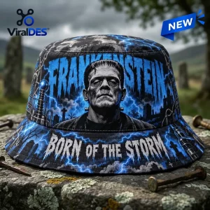 Front view of Frankenstein Born of the Storm Blue Bucket Hat with lightning and graveyard graphics.
