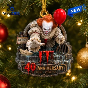 Front view of an IT 40th Anniversary Pennywise Christmas ornament featuring a clown holding a red balloon in a sewer grate.