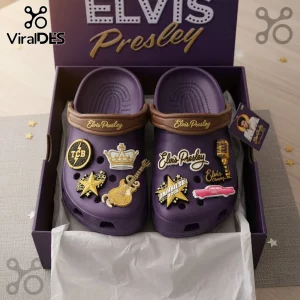 Elvis Presley Purple Crocband Clog With Charms featuring a guitar, TCB emblem, microphone, and crown in a branded box.