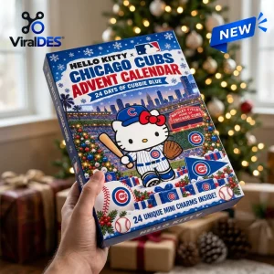 Hand holding a Hello Kitty x Chicago Cubs 2026 Advent Calendar box in front of a blurred Christmas tree.