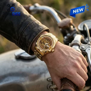 Indian Motorcycle 125th Anniversary Quartz Watch with a gold finish worn on a wrist over a black leather jacket.