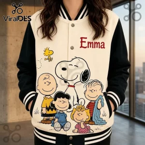 Peanuts Personalized Snoopy Emma Varsity Jacket with cream torso, black sleeves, and Peanuts character graphic.