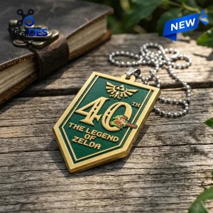 The Legend of Zelda 40th Anniversary Acrylic Car Ornament featuring a green shield design with gold trim and pixel art.