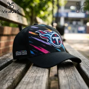 Tennessee Titans NFL Crucial Catch Black Cap featuring a multi-colored flaming logo and side embroidery on a wooden bench.