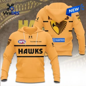 Hawthorn Football Club gold performance hoodie featuring AFL branding, Under Armour logo, and large Hawks text on front.