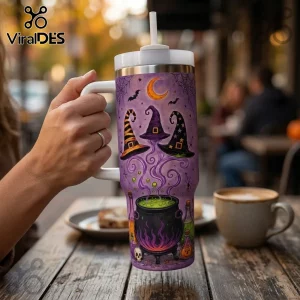 Halloween Magic Witches 40oz Handle Tumbler featuring purple background, floating witch hats, cauldron, and crescent moon.