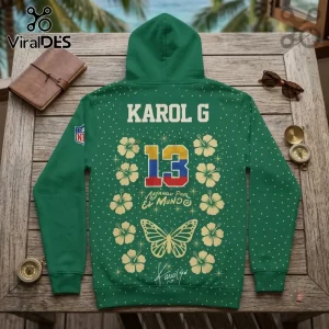 Karol G x Philadelphia Eagles Tropitour green hoodie featuring number 13, hibiscus flowers, and butterfly graphics on back.