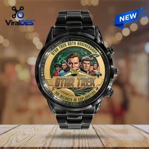 Front view of a black watch with a circular Star Trek 60th anniversary graphic dial featuring illustrated characters.