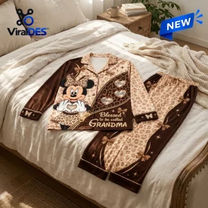 Personalized Minnie Mouse leopard pajama set with brown accents, floral motifs, and custom grandma-themed text on bed.