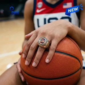 USA Basketball FIBA Women's World Cup 2026 Ring in gold with red, white, and blue accents resting on a basketball.