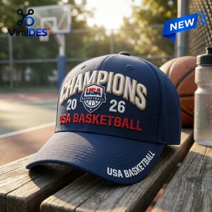 USA Basketball 2026 World Cup Champions navy baseball cap with white and red embroidered lettering on a wooden bench.