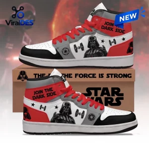 Side view of high top sneakers featuring a black-masked figure, starship graphics, and red accents.