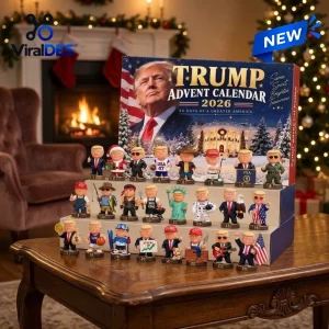 Front view of Trump Advent Calendar 2026 Christmas Countdown box with 24 figurine slots on a wooden table.