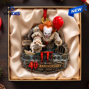 Top view of a Pennywise Christmas ornament featuring a clown emerging from a sewer drain holding a red balloon.