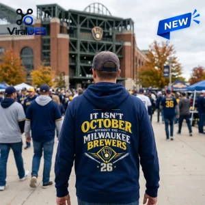 Milwaukee Brewers 2026 Postseason Blue Hoodie worn by a fan outside American Family Field with team graphics on the back.