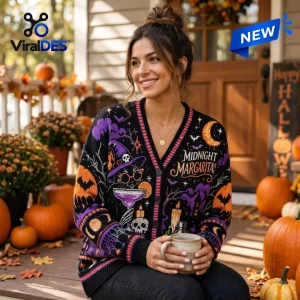 Woman wearing Midnight Margaritas Witch Cat Halloween Ugly Cardigan on porch.