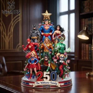Justice League 2026 Superhero Christmas Tree Ornament featuring Superman, Batman, Wonder Woman, and others on a pedestal base.