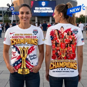 USA Women's Basketball 2026 World Cup Champions shirt featuring a trophy graphic, red, white, and blue colors on a white tee.