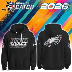Philadelphia Eagles 2026 Crucial Catch black hoodie featuring multi-colored team graphics and NFL logo detailing.