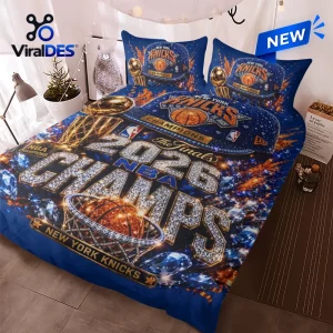 New York Knicks 2026 NBA Champions bedding set with blue fabric, Larry O'Brien trophy graphics, and diamond text accents.