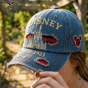 Disney Magic Kingdom Vintage Distressed Denim Cap featuring a castle embroidery, red accents, and frayed fabric edges.