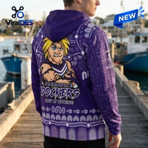 Back view of Fremantle Dockers Purple Indigenous Pullover Hoodie worn outdoors.