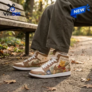 Side view of beige Air Jordan 1 sneakers featuring cartoon character prints worn outdoors on a park path.