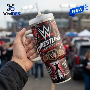 Hand holding a wrestling themed Stanley tumbler with a straw and stadium graphic background.
