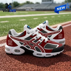Side view of maroon and white Alabama A&M Bulldogs sneakers featuring a collegiate logo on a track and field background.
