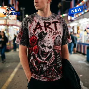 Front view of an Art the Clown Smile Horror Shirt worn outdoors at night with carnival lights.