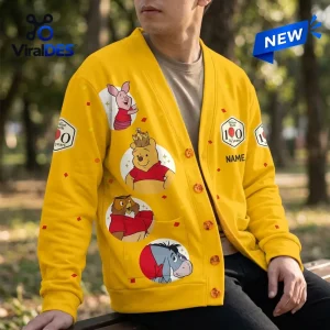 Winnie the Pooh 100th Anniversary yellow knitted cardigan featuring Piglet, Owl, and Eeyore circular character patches.